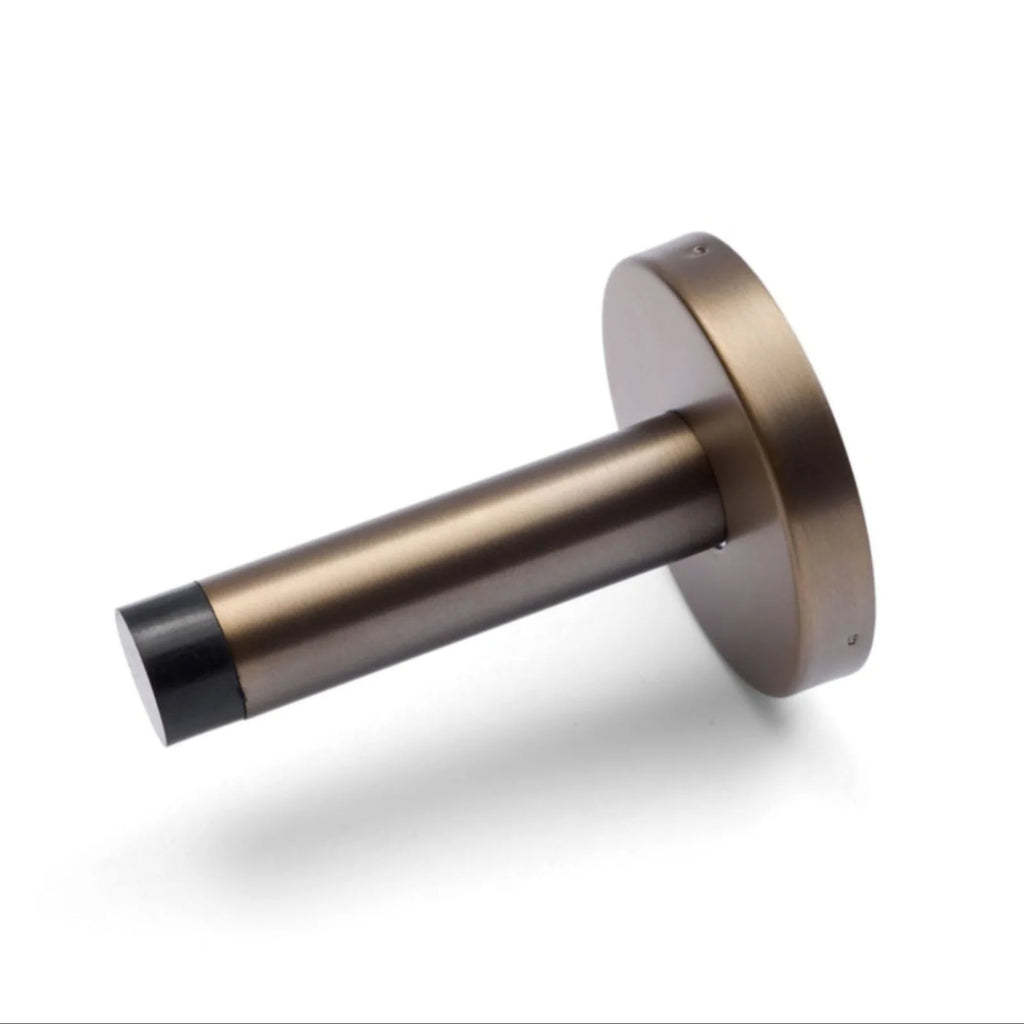 Manovella Wall Mounted Straight Door Stop - Aged Brass